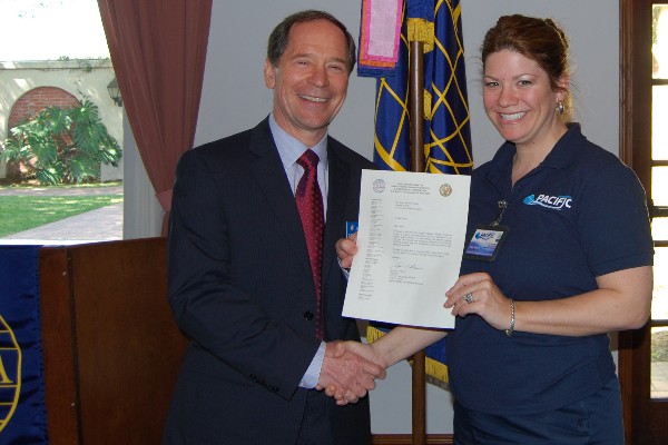 In March, Bauer presents a letter of appreciation to Anne Wilson for her contributions to the chapter, both as the former secretary and as a Young AFCEAN.